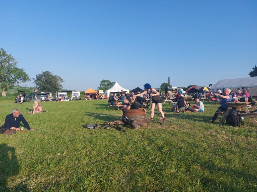 woman pulling man, both dressed as punks, from bin at Cursus Festival 2023