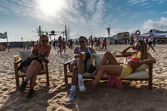 Rhythm + Waves people on beach